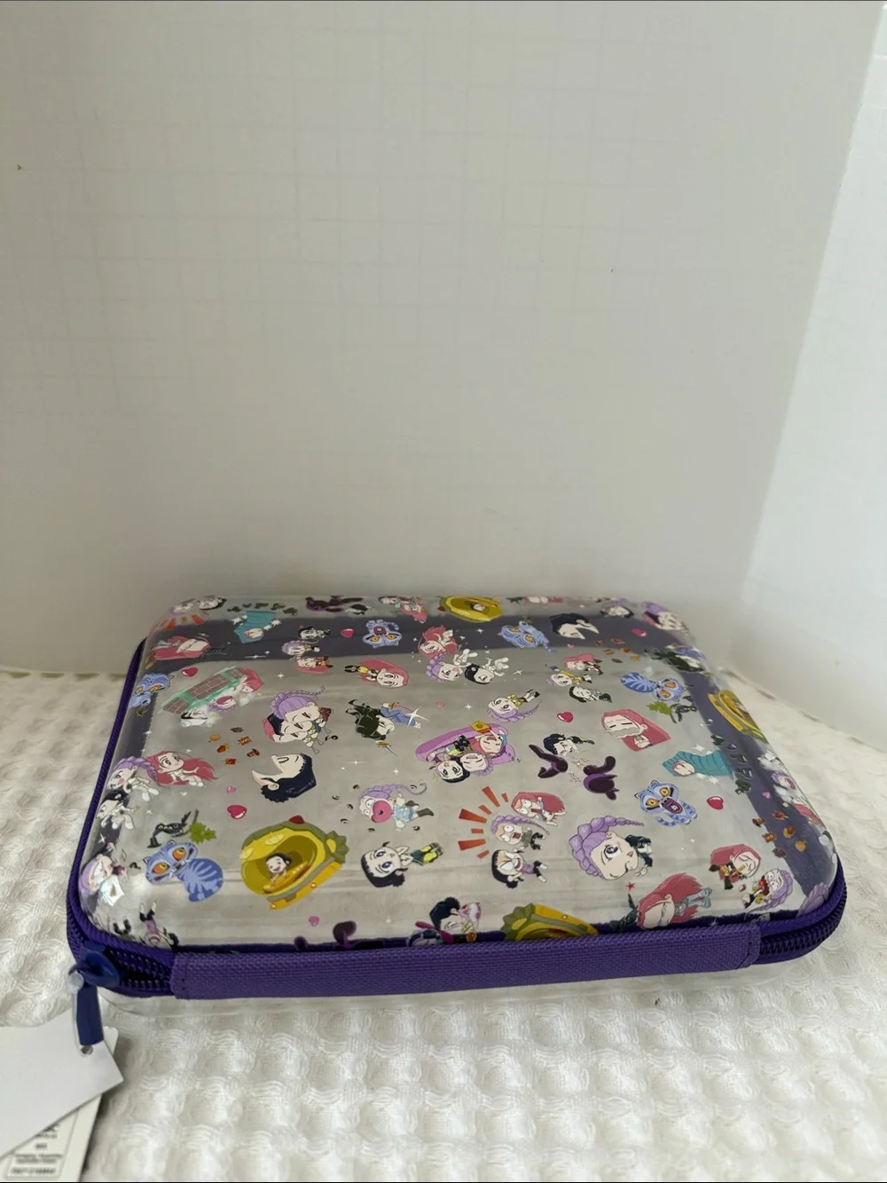 Netflix K-POP Demon Hunters Chibi-Style Clear PVC Pencil Case with Purple Trim.